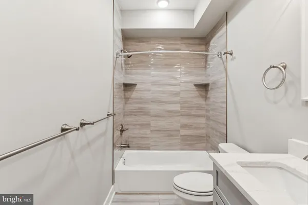 a bathroom with a toilet and shower