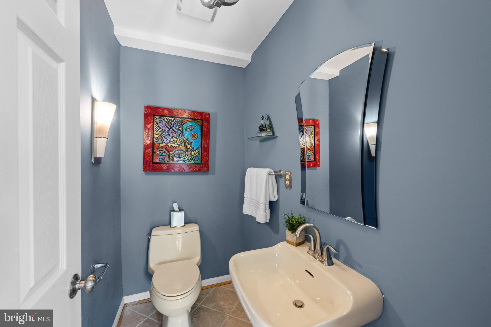 3529 Yuma Street Northwest Washington, DC 20008 - Photo 15 of 46 a bathroom with a toilet sink and mirror