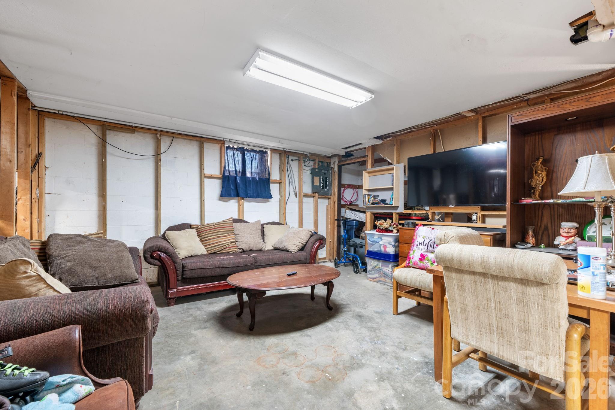 103 Hamp Street Morganton, NC 28655 - Photo 26 of 42 a living room with furniture and a flat screen tv