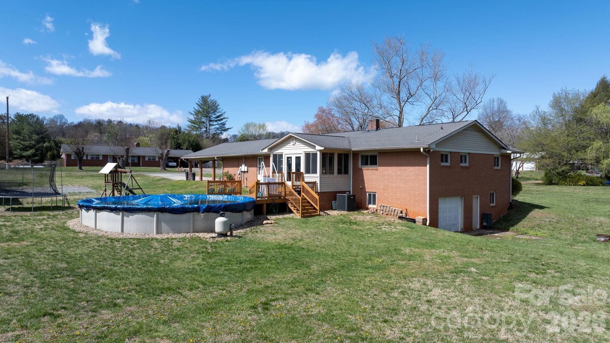 103 Hamp Street Morganton, NC 28655 - Photo 33 of 42 a view of a house with a yard and sitting area
