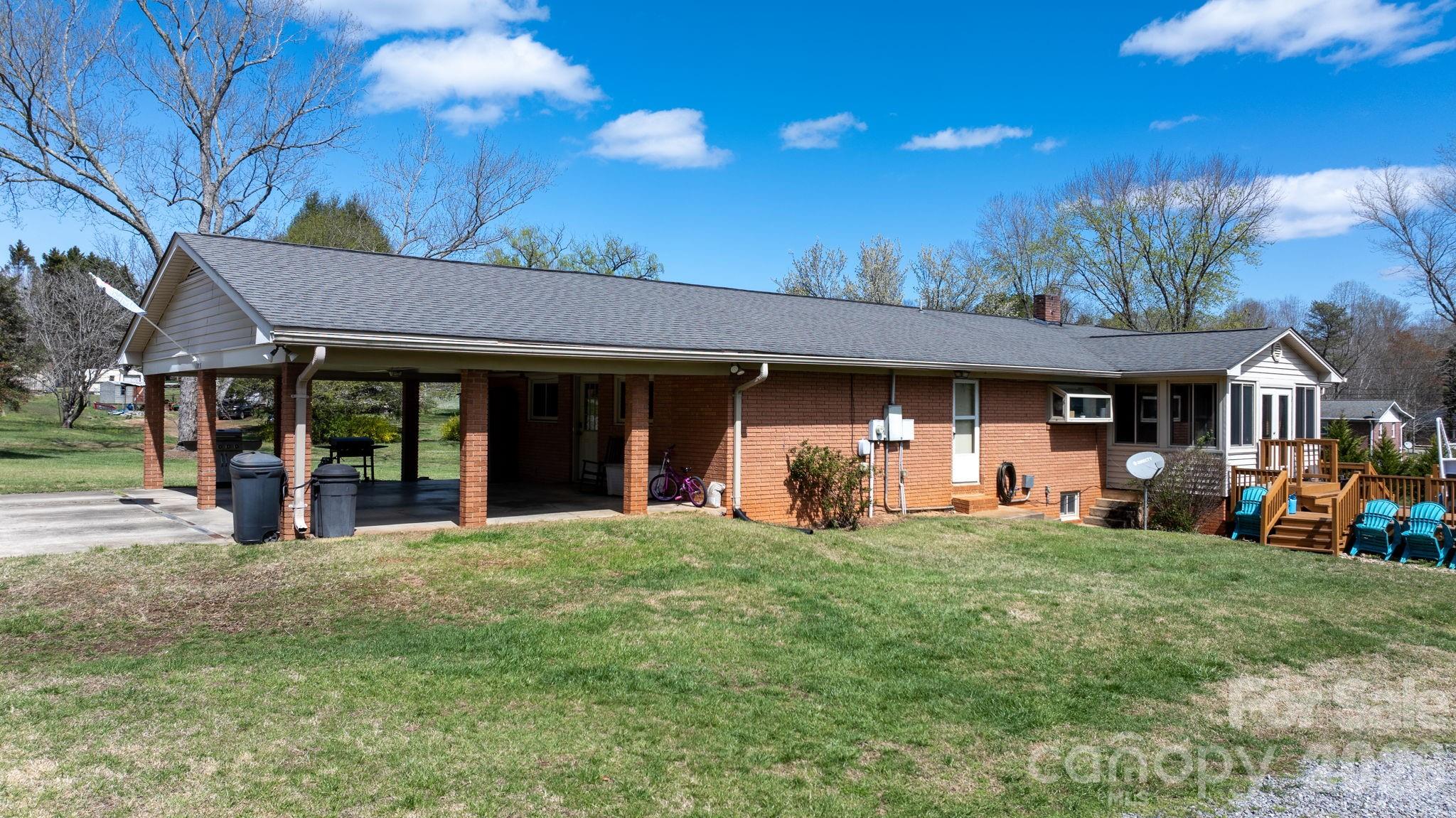 103 Hamp Street Morganton, NC 28655 - Photo 40 of 42 a front view of a house with a garden and patio