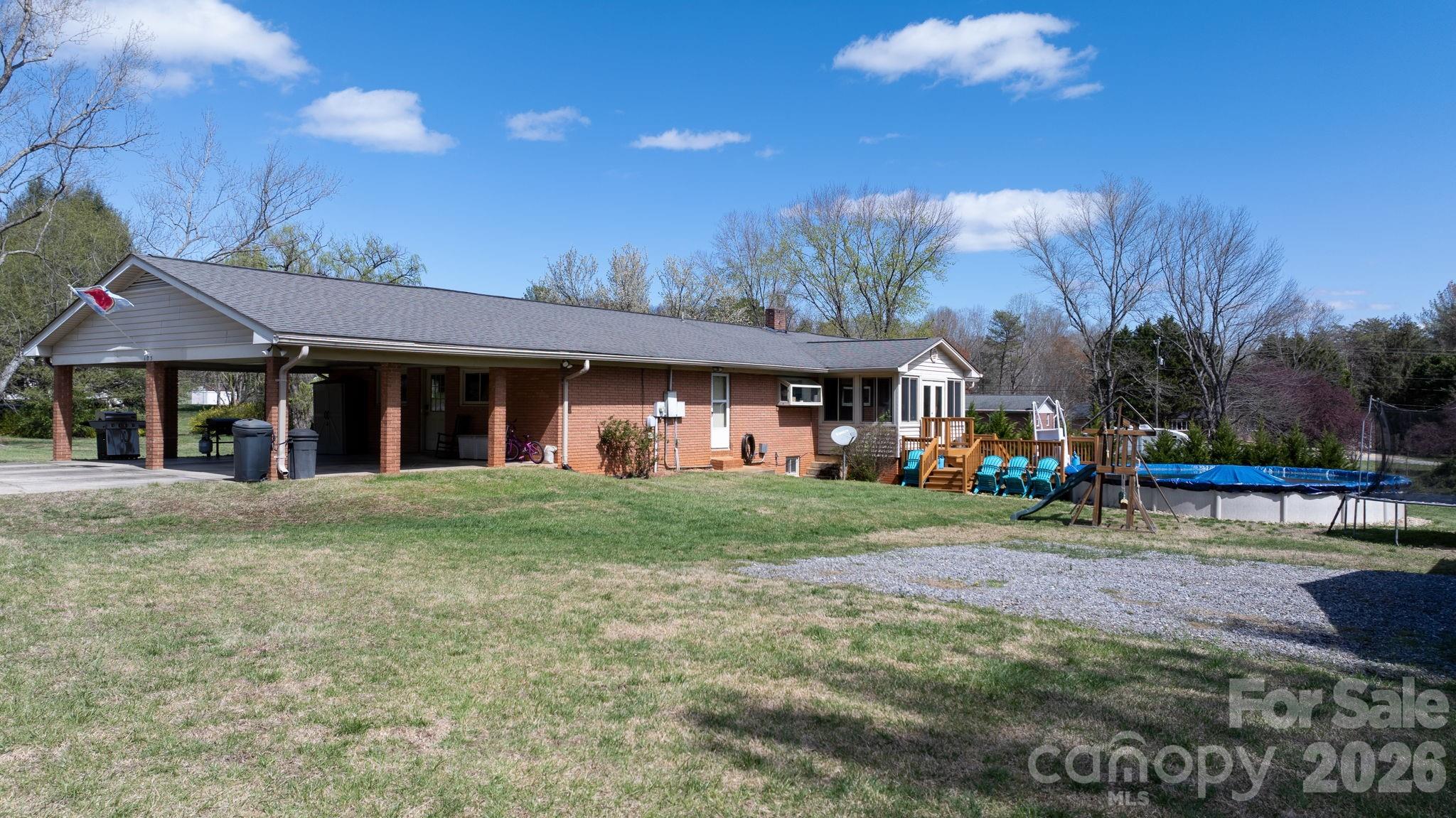 103 Hamp Street Morganton, NC 28655 - Photo 41 of 42 a view of a house with a yard and sitting area