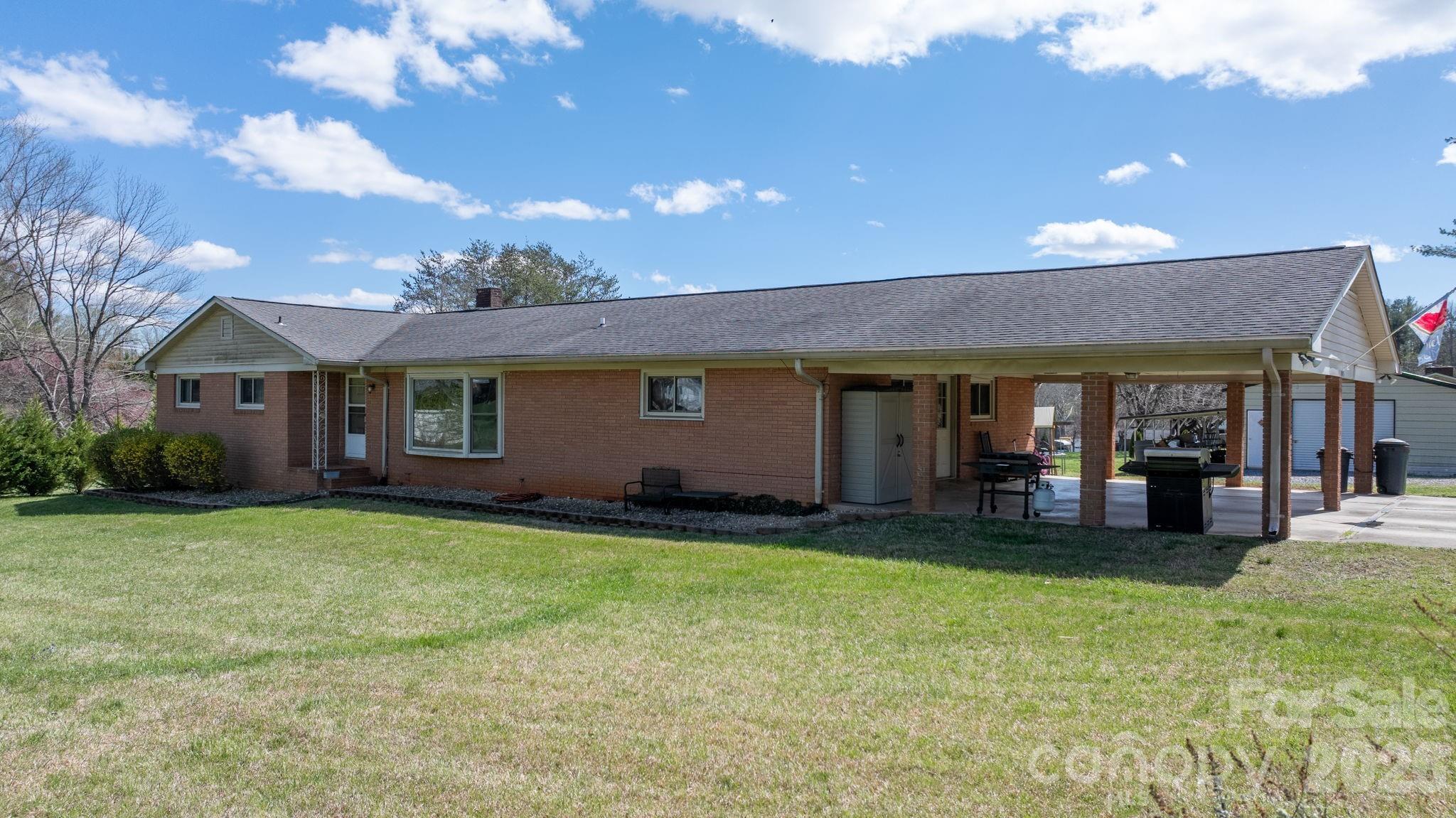 103 Hamp Street Morganton, NC 28655 - Photo 5 of 42 a view of a house with a yard porch and sitting area