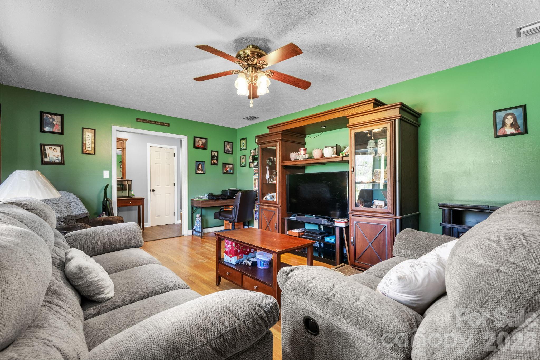 103 Hamp Street Morganton, NC 28655 - Photo 7 of 42 a living room with furniture and a flat screen tv
