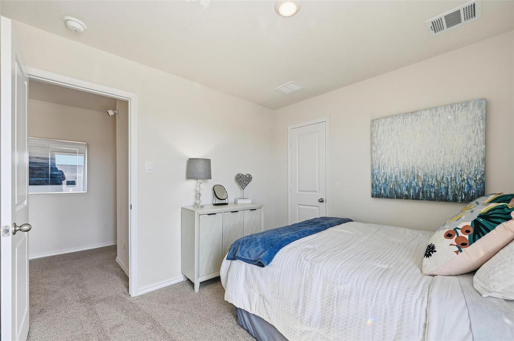 6016 Primrose Road Princeton, TX 75407 - Photo 14 of 23 a bedroom with a bed and a painting