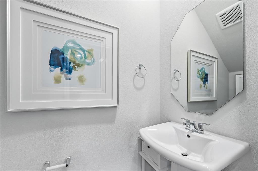 6016 Primrose Road Princeton, TX 75407 - Photo 15 of 23 a bathroom with a sink and a mirror
