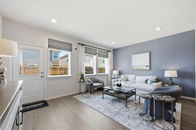 a living room with furniture and a window