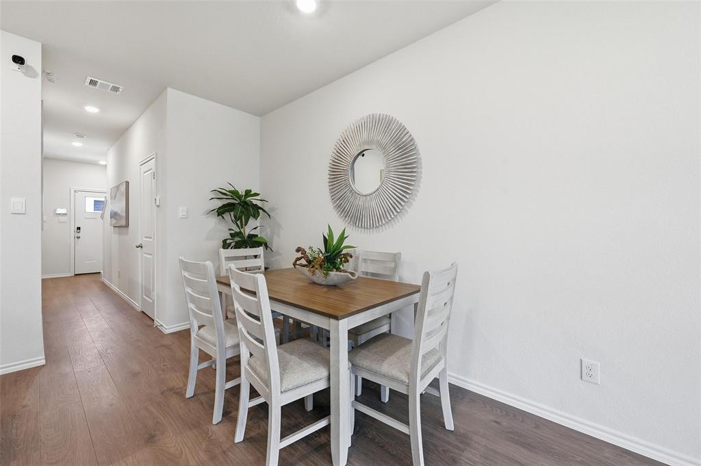 6016 Primrose Road Princeton, TX 75407 - Photo 4 of 23 a dining room with furniture and wooden floor