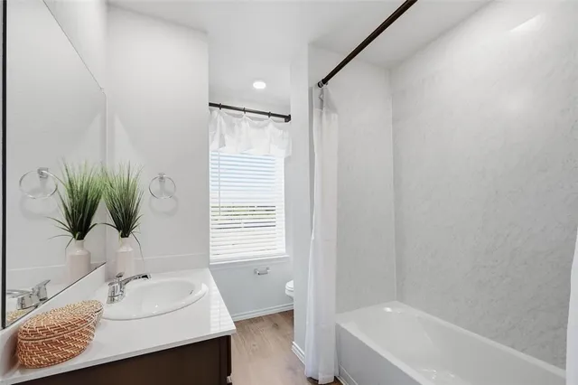 a bedroom with a bed and a table in it