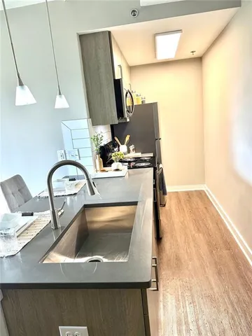 a bathroom with a sink toilet and mirror