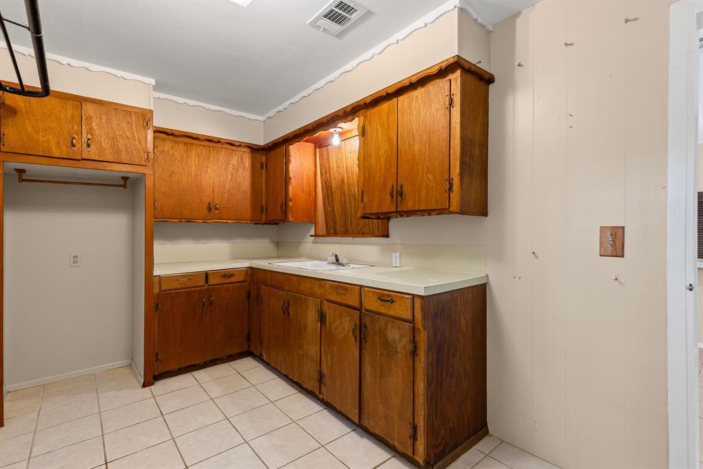 122 Fm 275 Emory, TX 75440 - Photo 16 of 38 a kitchen with a sink cabinets and wooden floor