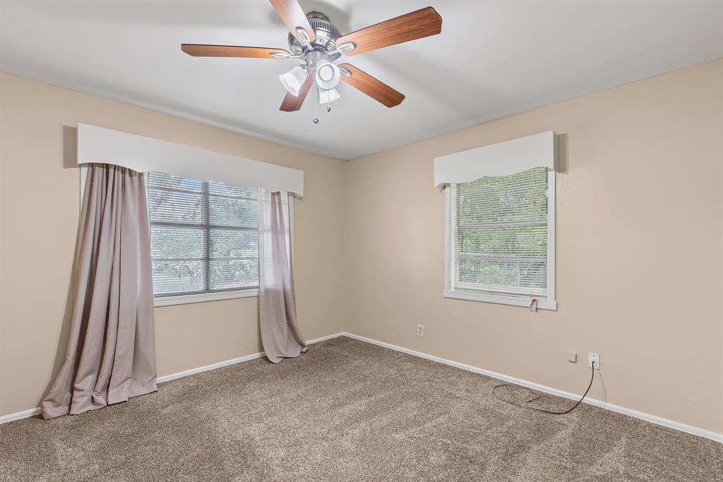 122 Fm 275 Emory, TX 75440 - Photo 17 of 38 an empty room with windows and fan