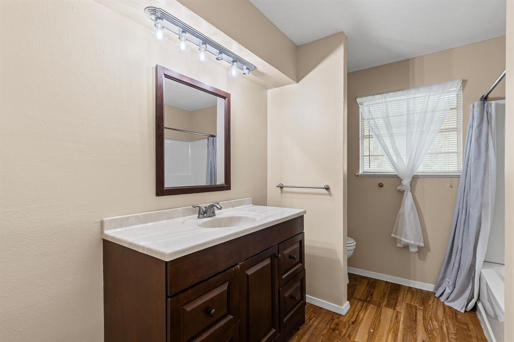 122 Fm 275 Emory, TX 75440 - Photo 19 of 38 a bathroom with a sink a mirror and a shower