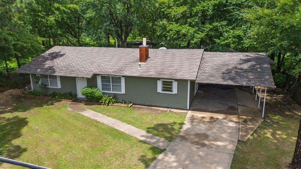 122 Fm 275 Emory, TX 75440 - Photo 30 of 38 a front view of a house with a yard
