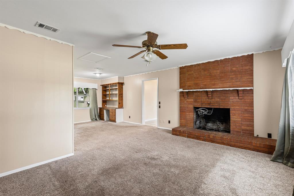 122 Fm 275 Emory, TX 75440 - Photo 6 of 38 a view of empty room with fireplace and window