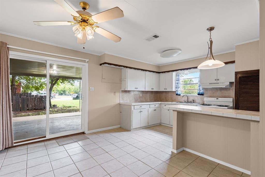 122 Fm 275 Emory, TX 75440 - Photo 10 of 38 a kitchen with a sink a counter top space appliances and cabinets