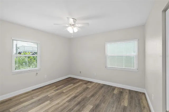 a view of an empty room with a fan