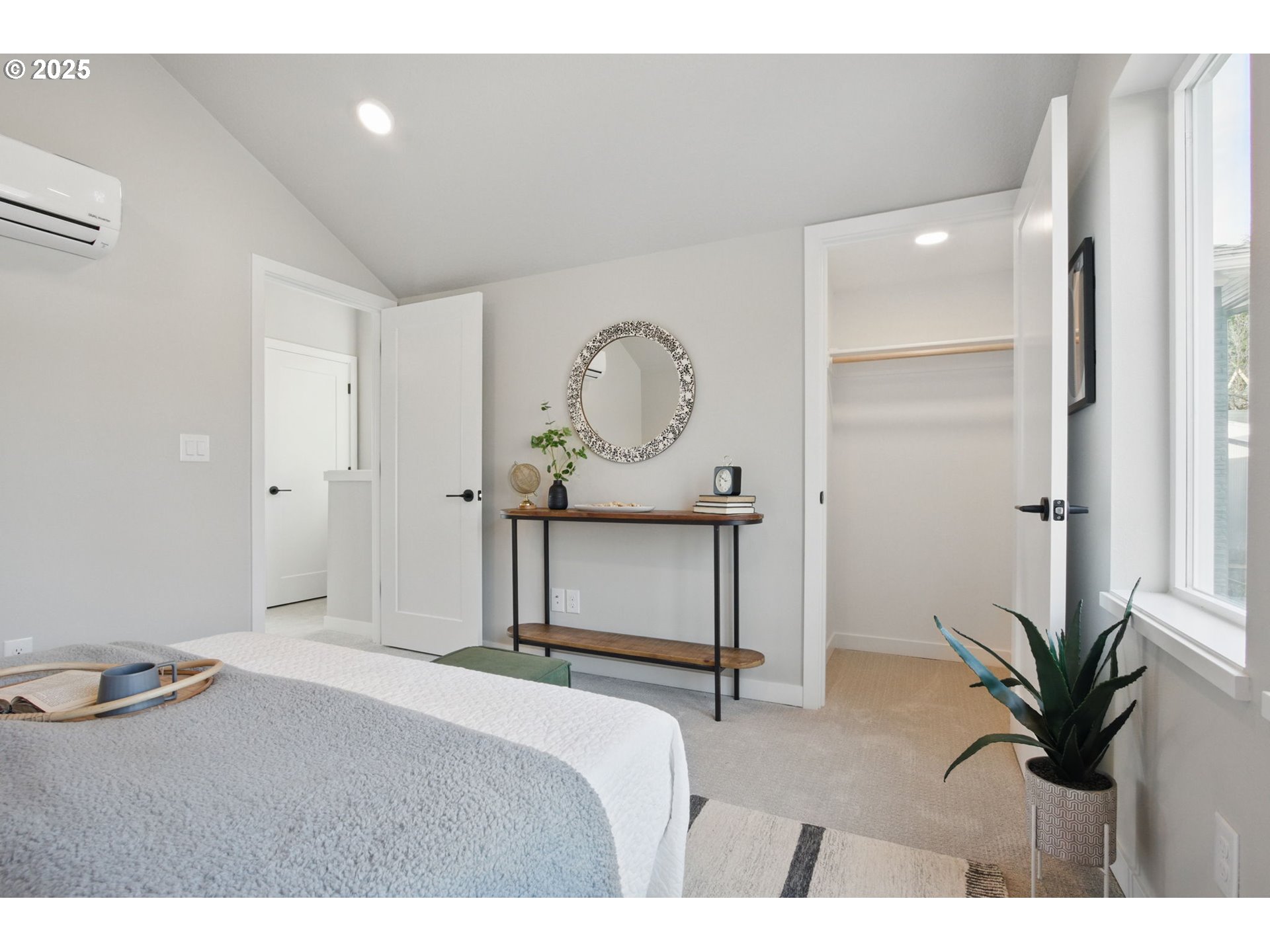 1123 Southeast Rhone Street, Unit B Portland, OR 97202 - Photo 18 of 22 a bedroom with a bed and a potted plant on table