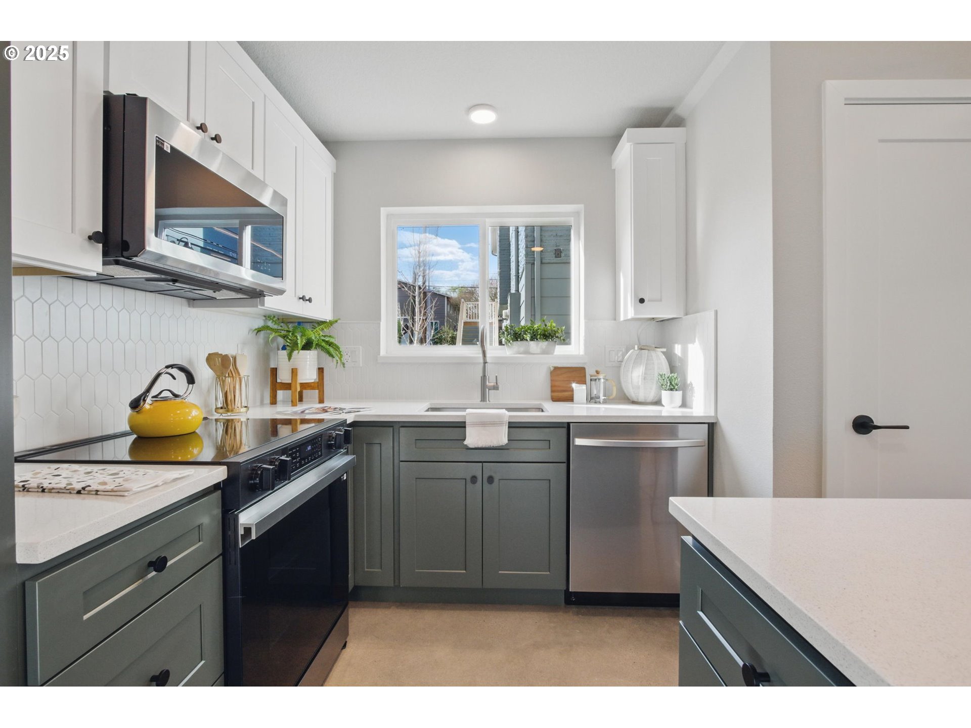1123 Southeast Rhone Street, Unit B Portland, OR 97202 - Photo 3 of 22 a kitchen with cabinets and window