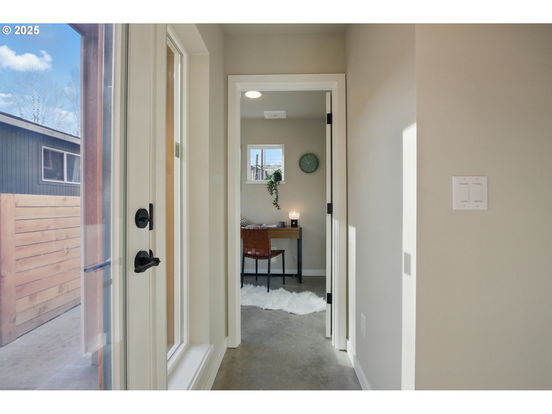 1123 Southeast Rhone Street, Unit B Portland, OR 97202 - Photo 7 of 22 a view of a bedroom from a hallway