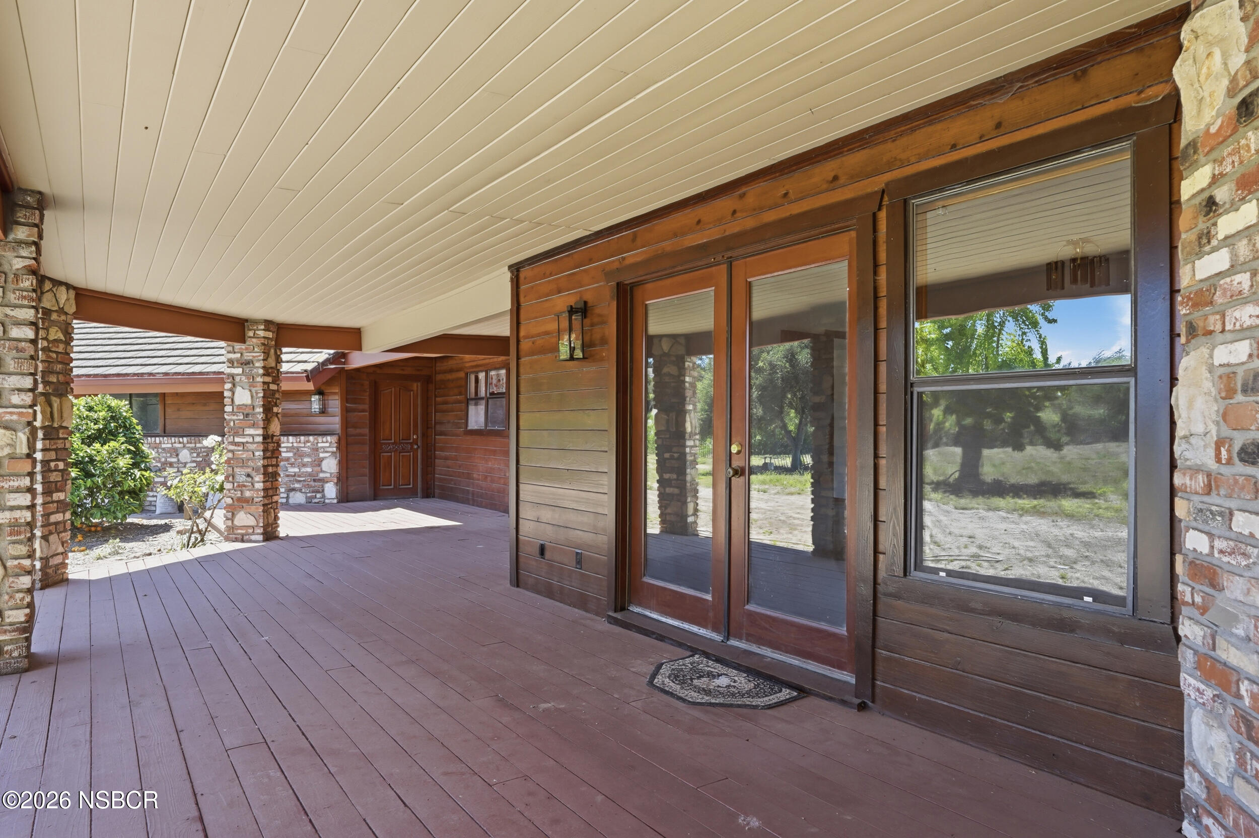 140 East Rice Ranch Road Santa Maria, CA 93455 - Photo 37 of 44 a empty room with sliding glass door and wooden floor
