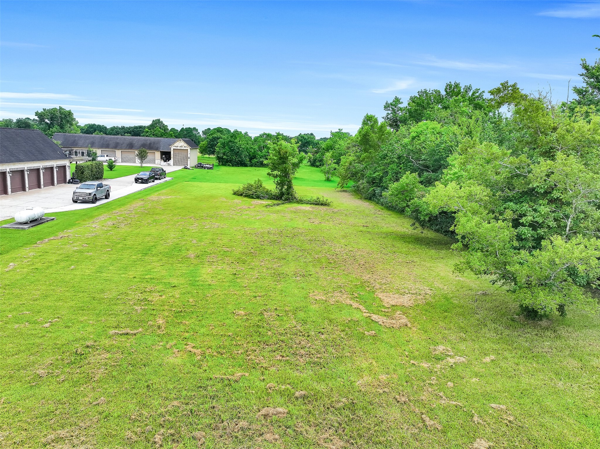 16724 Harkey Road Pearland, TX 77584 - Photo 28 of 34 Looking over the back pasture - what will you dream here? A new custom home, a horse ring/arend? Open, peaceful country? It could be yours to curate!