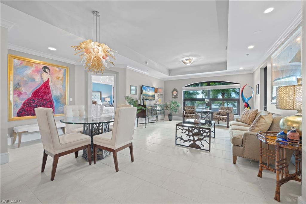 9115 Strada Place, Unit 5314 Naples, FL 34108 - Photo 3 of 44 a living room with furniture and a large window