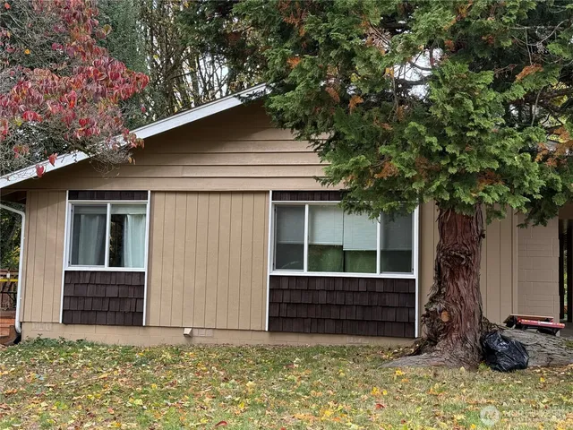 a house with a tree in front of it