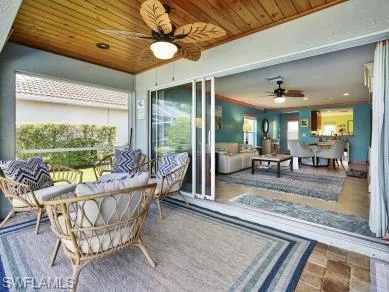 a view of a dining room with furniture wooden floor and chandelier