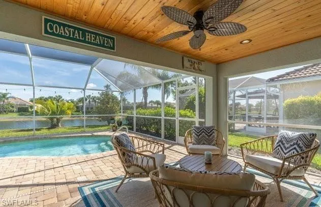 a view of a chairs and table in patio with a garden