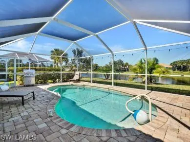 a view of a swimming pool with a patio