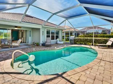a view of a house with a backyard porch and sitting area