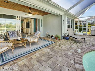 8693 Querce Court Naples, FL 34114 - Photo 25 of 50 a outdoor space with lots of furniture and windows