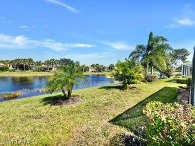 a view of a lake with a yard