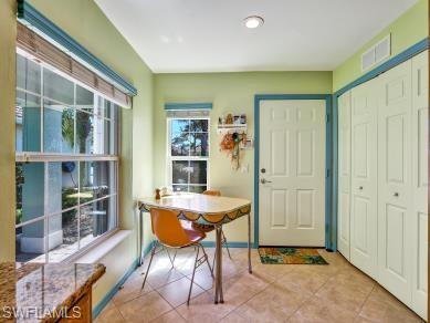 8693 Querce Court Naples, FL 34114 - Photo 3 of 50 a view of a dining room with furniture and window