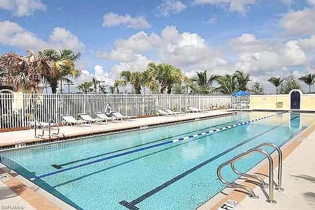 8693 Querce Court Naples, FL 34114 - Photo 34 of 50 a view of swimming pool with outdoor seating and city view