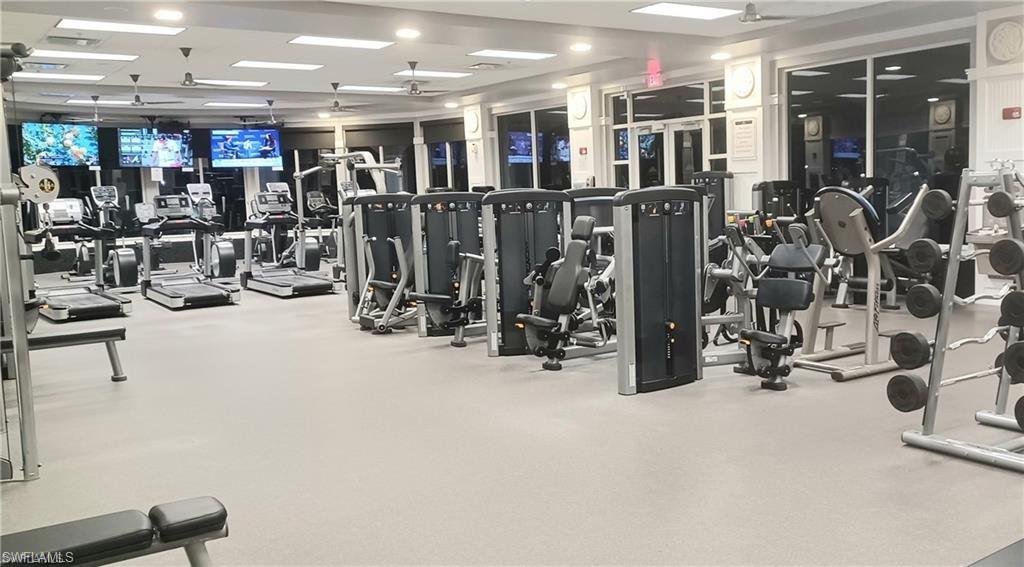8693 Querce Court Naples, FL 34114 - Photo 42 of 50 a view of a room with gym equipment