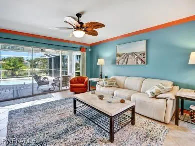 a living room with furniture a table and a large window