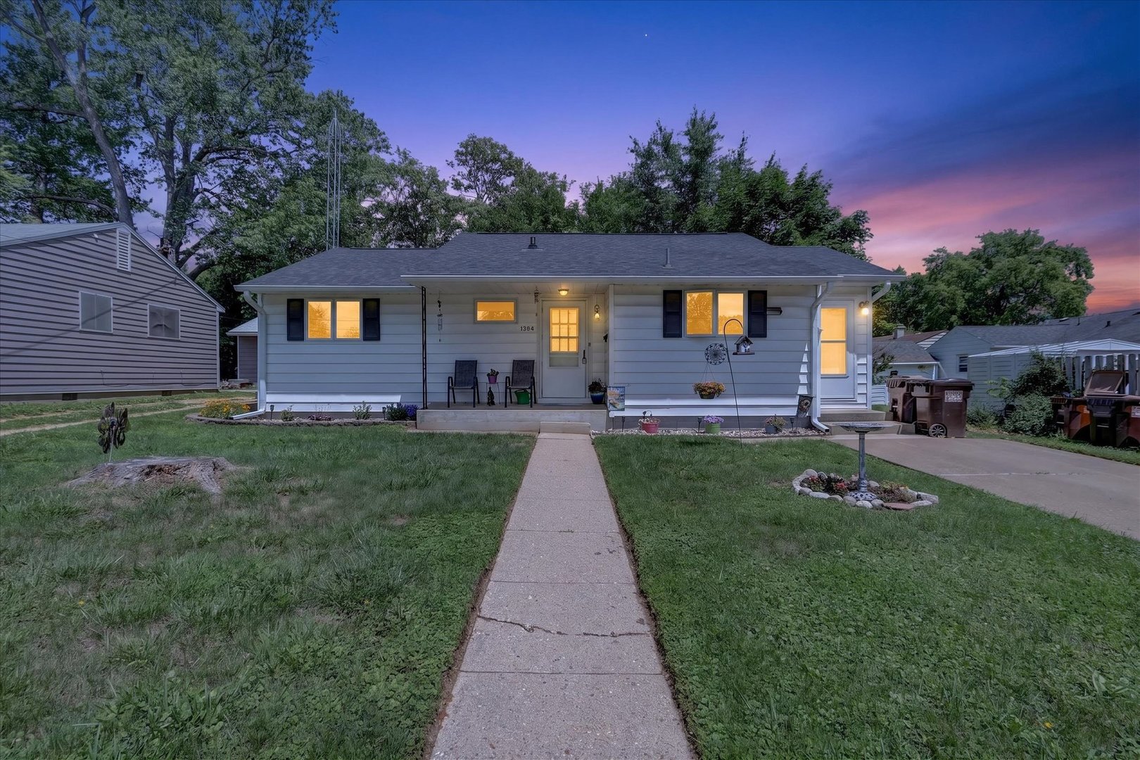1204 West Violet Street Freeport, IL 61032 - Photo 2 of 36 a front view of a house with a yard and trees