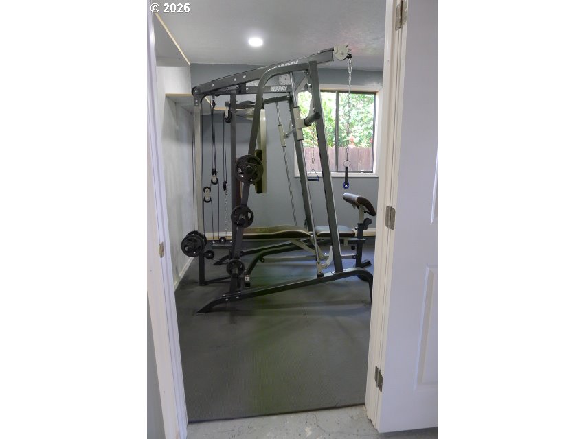 412 Camellia Court Reedsport, OR 97467 - Photo 15 of 48 a view of a room with gym equipment