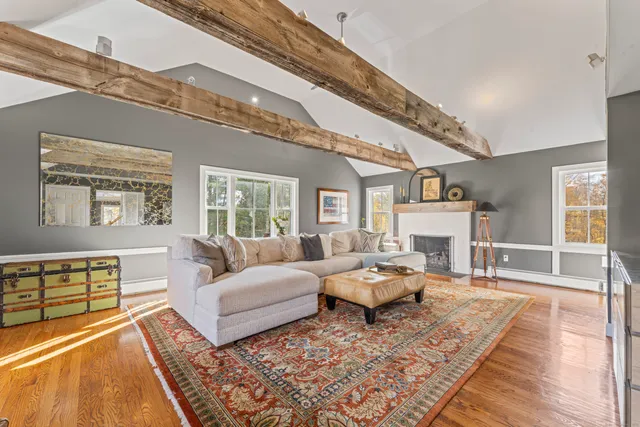 a living room with furniture and a table
