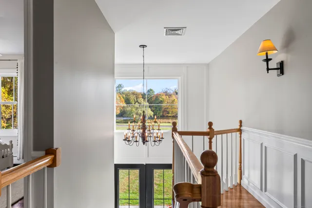 a bed room with a bed and a chair