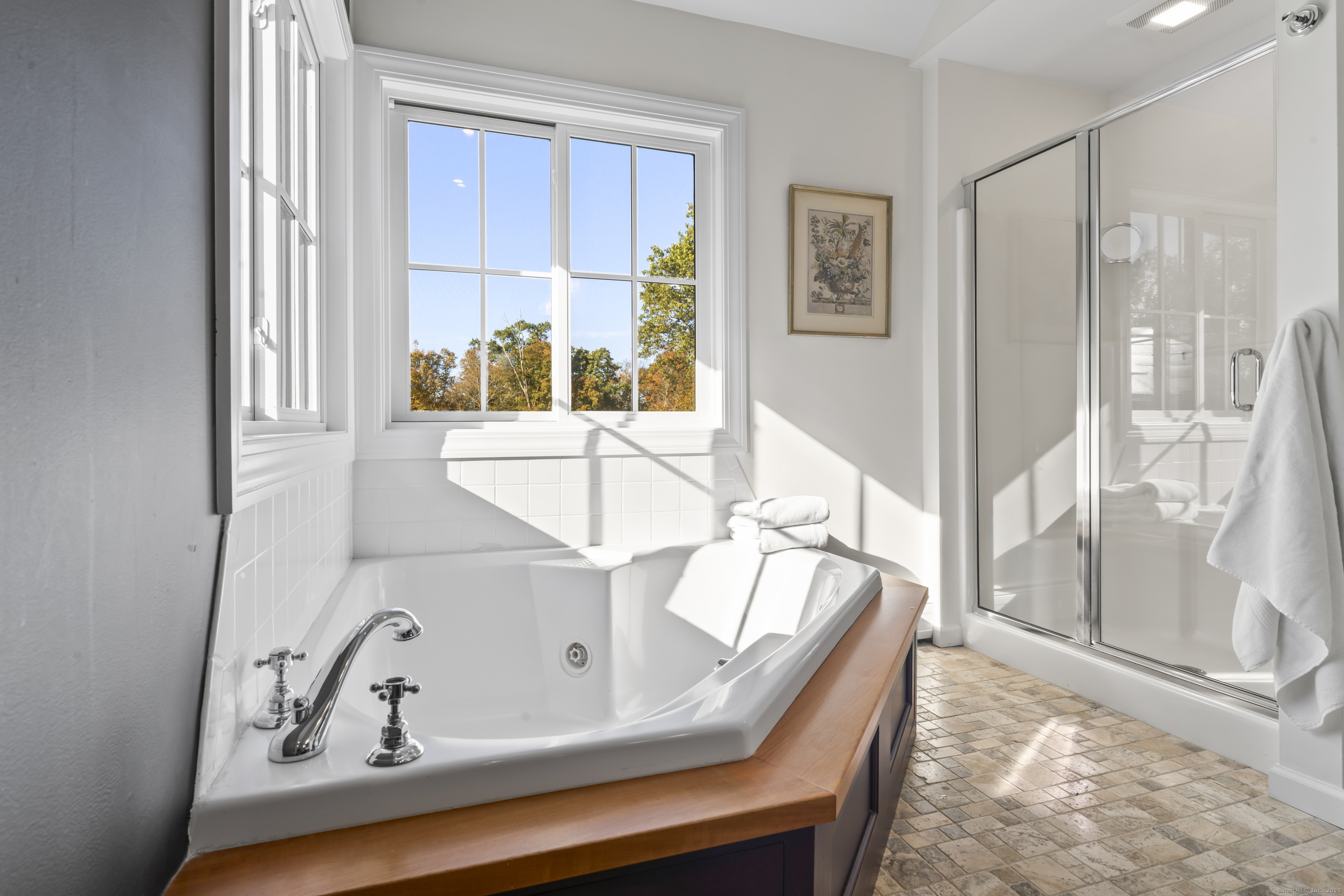 40 Great Ring Road Newtown, CT 06482 - Photo 19 of 39 a view of a bath tub sitting in a bathroom