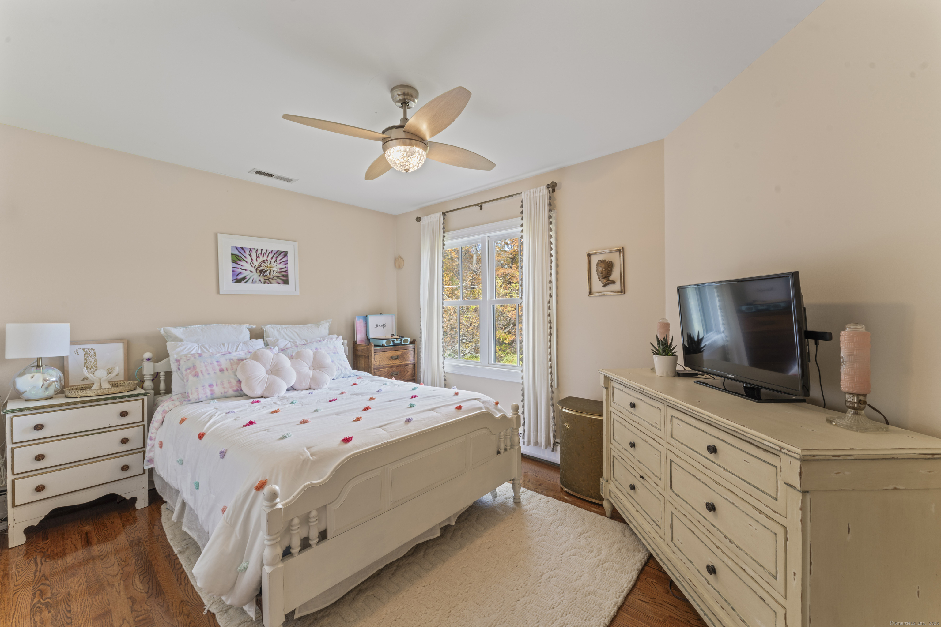 40 Great Ring Road Newtown, CT 06482 - Photo 20 of 39 a bedroom with a bed and a flat screen tv