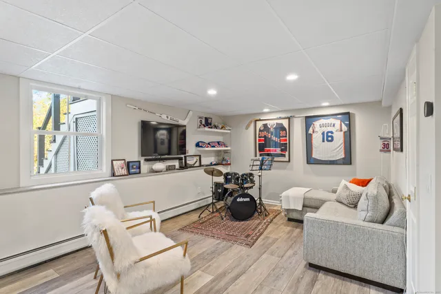 a view of a play room with toys and wooden floor