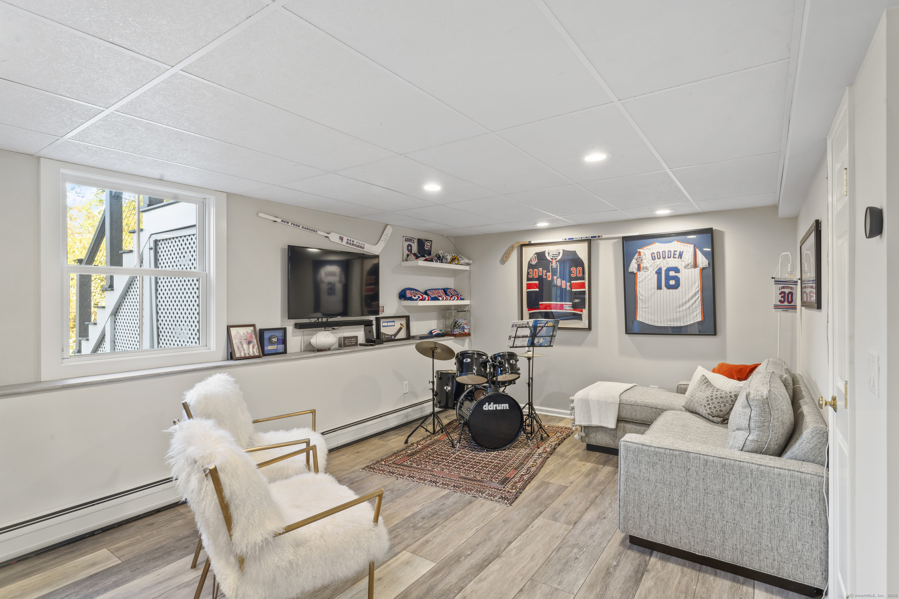 40 Great Ring Road Newtown, CT 06482 - Photo 24 of 39 a living room with furniture and a flat screen tv