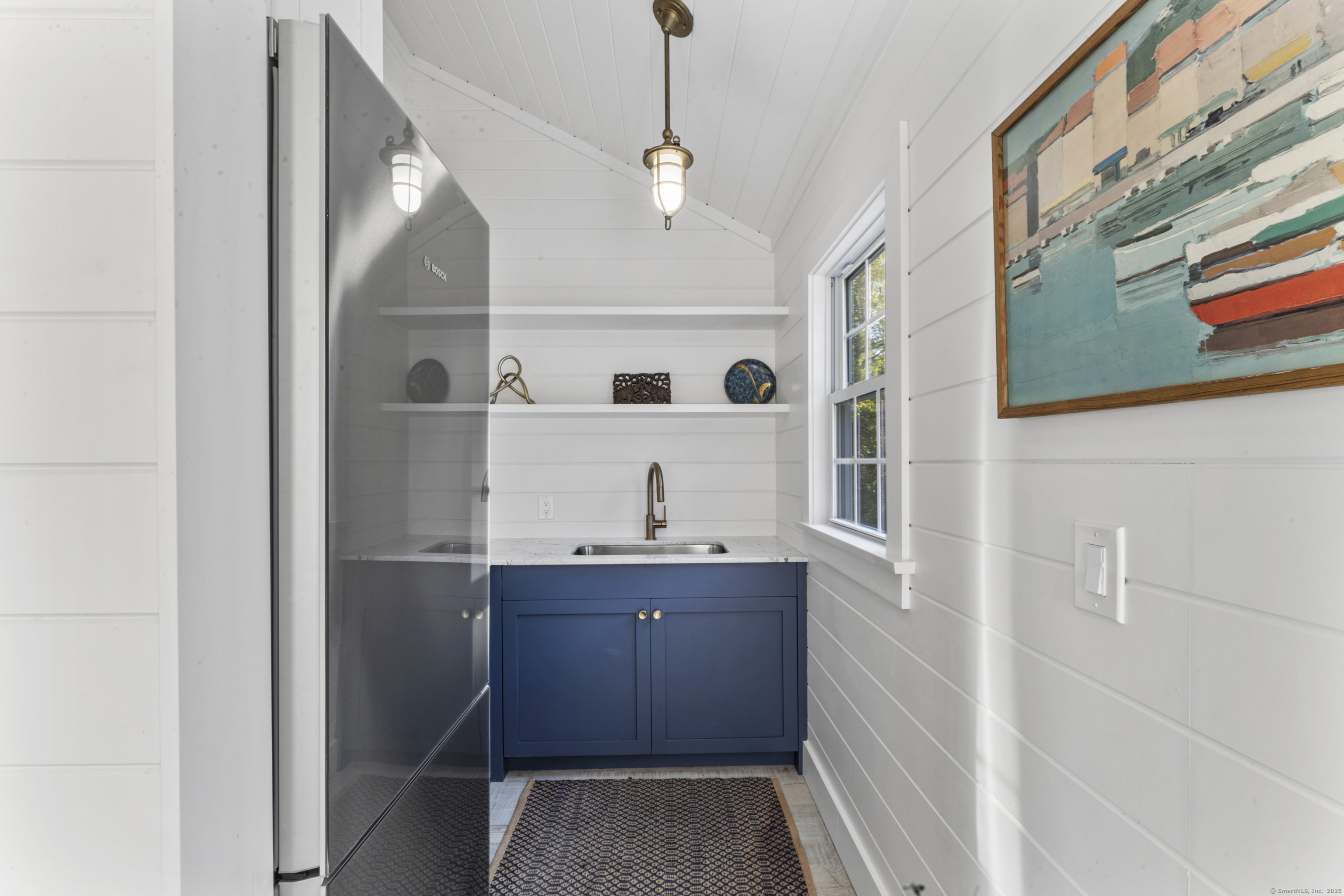40 Great Ring Road Newtown, CT 06482 - Photo 31 of 39 a kitchen with a refrigerator and a window