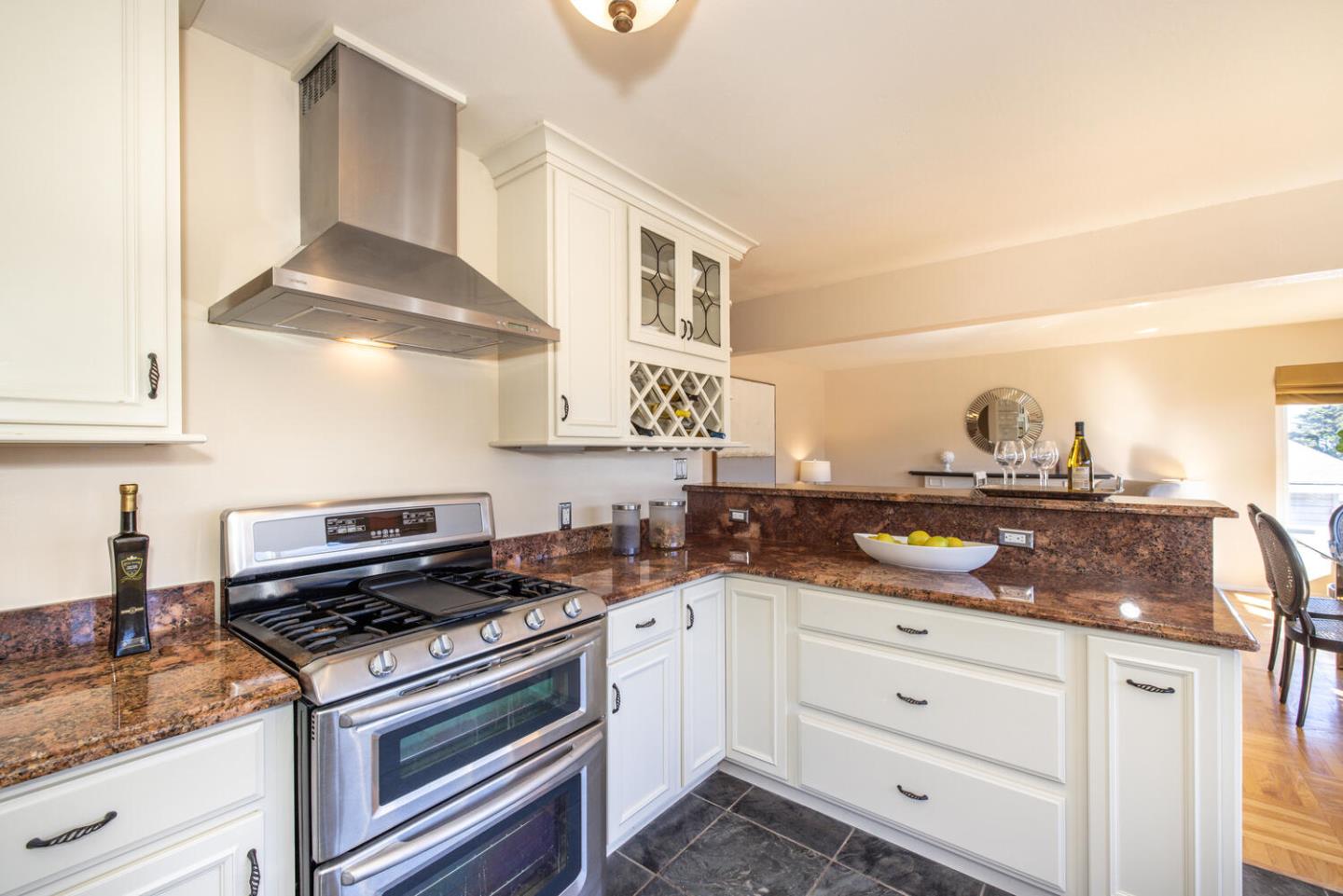 1420 Crespi Drive Pacifica, CA 94044 - Photo 11 of 48 a kitchen with stainless steel appliances granite countertop a sink and cabinets
