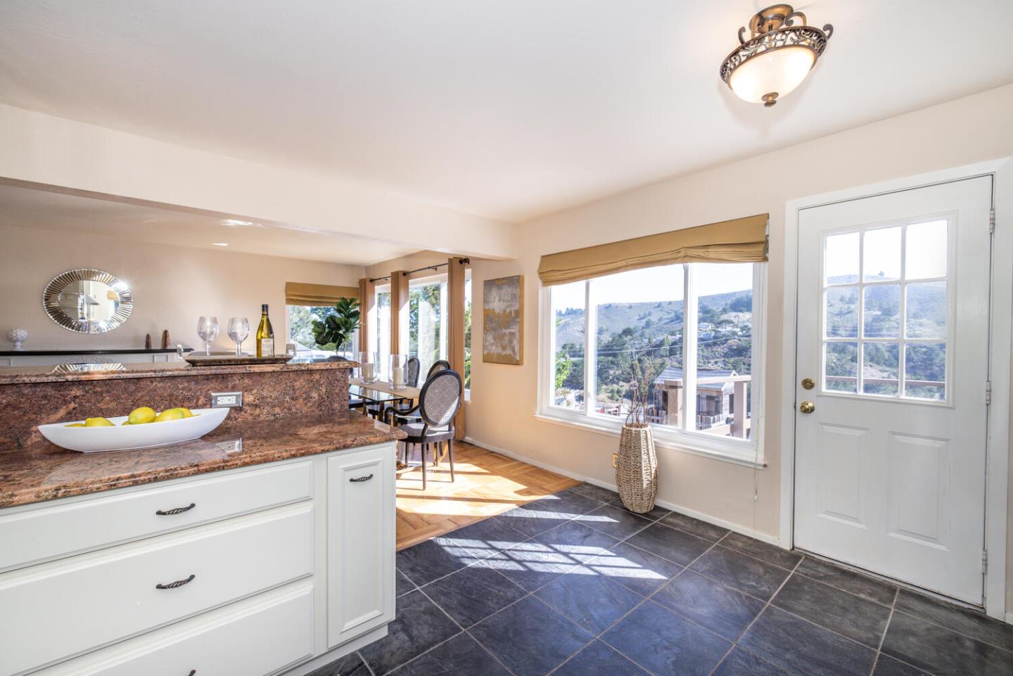 1420 Crespi Drive Pacifica, CA 94044 - Photo 13 of 48 a living room with granite countertop furniture and a floor to ceiling window