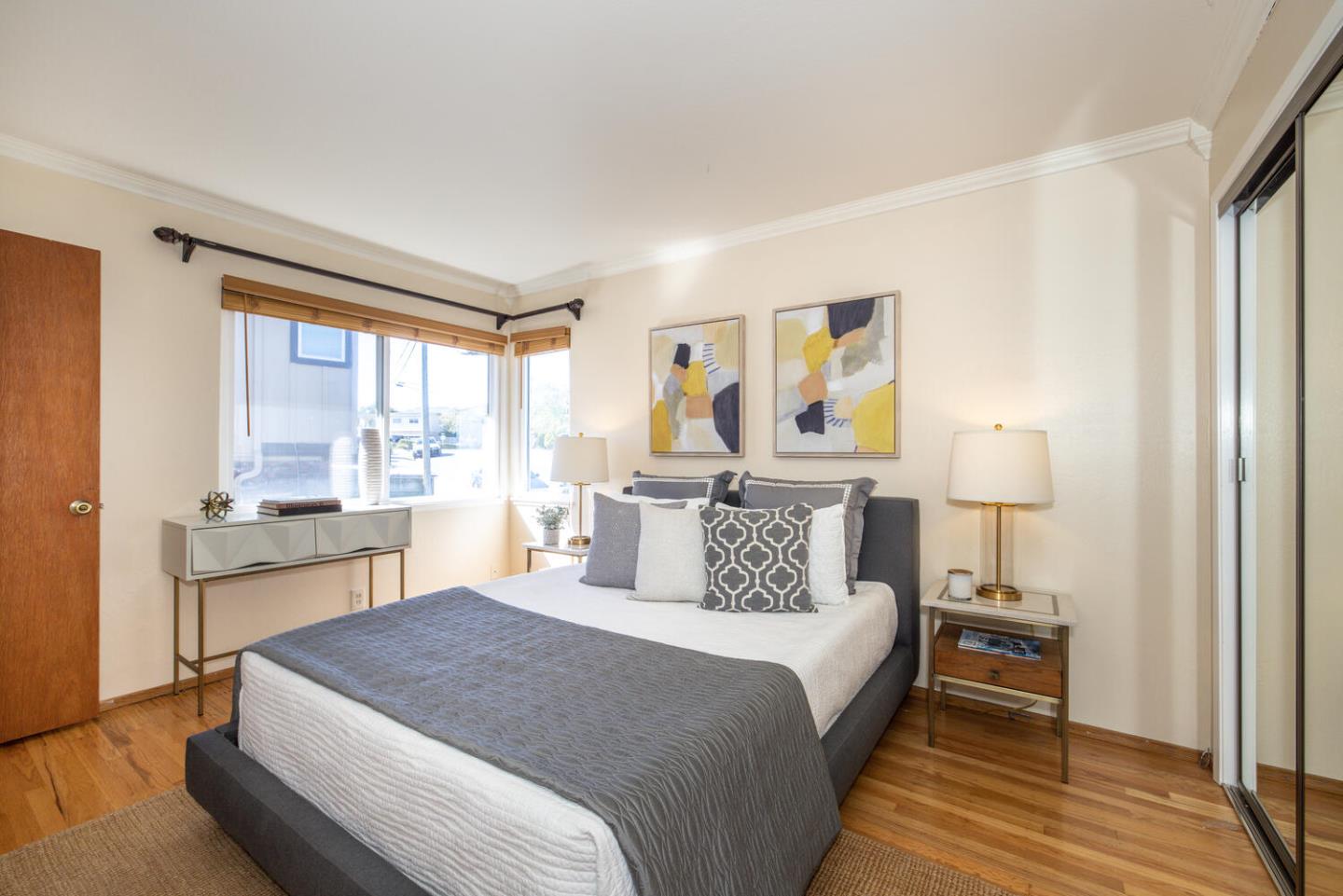 1420 Crespi Drive Pacifica, CA 94044 - Photo 15 of 48 a bedroom with a large bed and a window